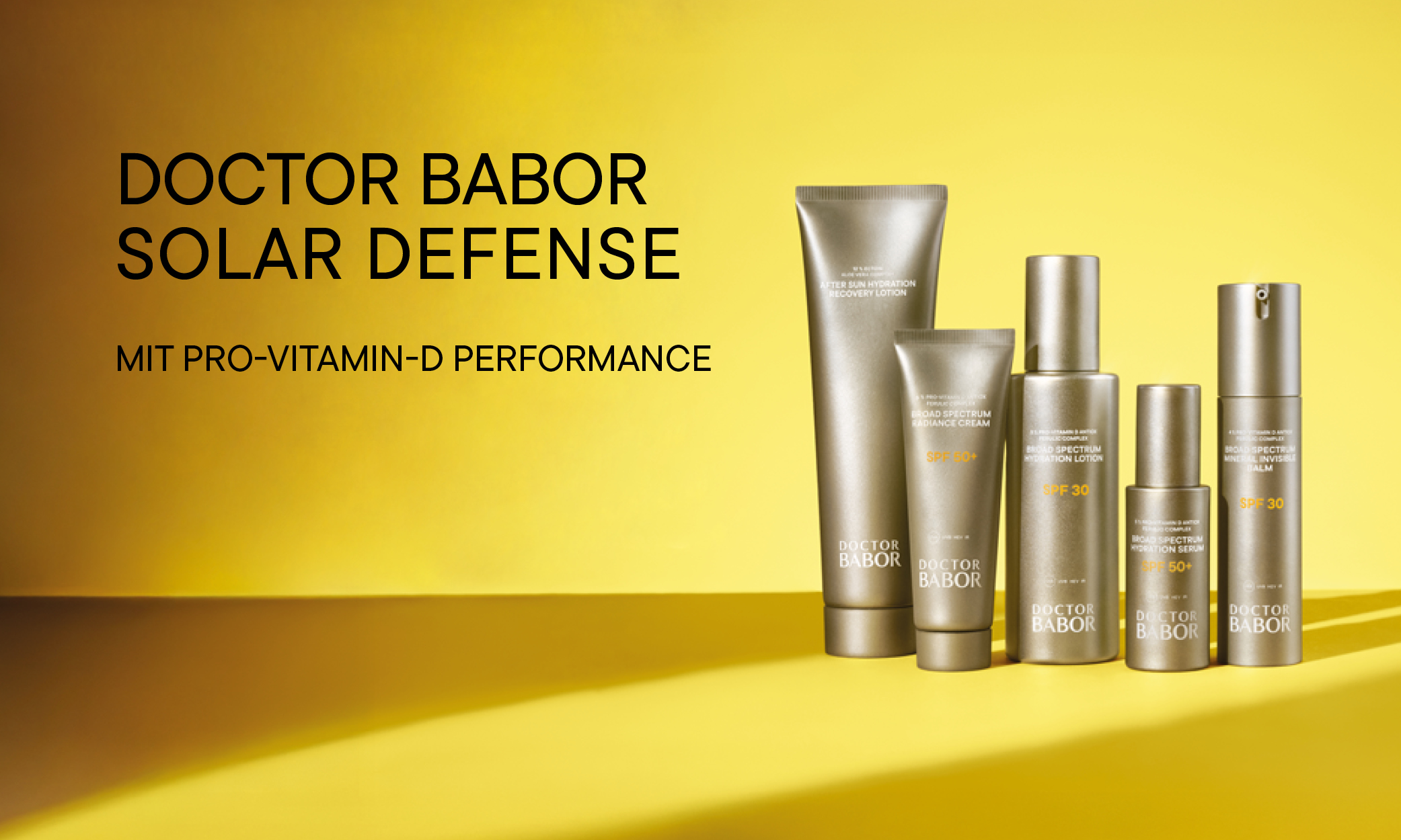 Werbebanner der DOCTOR BABOR Solar Defense Serie: fünf silbergraue Sonnenpflege-Produkte vor gelbem Hintergrund.